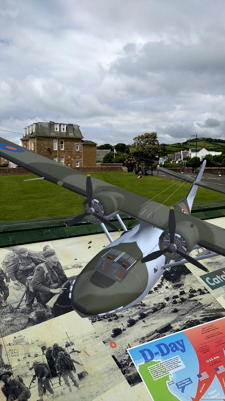 Close-up of model PBY Catalina flying above the panel installation of Largs D-Day Connection